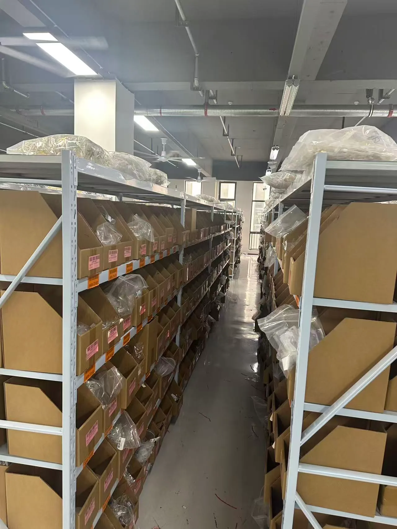 Original warehouse photograph showing rows of stock shelves